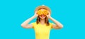 Summer portrait of happy smiling young woman covering her eyes with flowers as binoculars looking for something wearing round Royalty Free Stock Photo