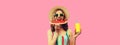 Summer portrait of happy smiling young woman eating fresh juicy slice of watermelon with cup of juice wearing straw hat on pink Royalty Free Stock Photo