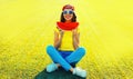 Summer portrait of happy smiling young woman eating fresh juicy slice of watermelon on the grass in the summer park Royalty Free Stock Photo