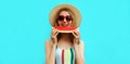 Summer portrait happy smiling young woman eating a slice of watermelon wearing straw hat on blue background Royalty Free Stock Photo