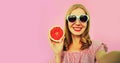 Summer portrait of happy smiling young woman posing stretching her hand for taking selfie with smartphone with juicy slice of Royalty Free Stock Photo