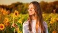 Summer portrait of happy young woman in hat with long hair in field enjoying nature Royalty Free Stock Photo