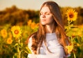 Summer portrait of happy young woman in hat with long hair in field enjoying nature Royalty Free Stock Photo