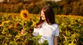 Summer portrait of happy young woman in hat with long hair in field enjoying nature Royalty Free Stock Photo