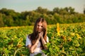Summer portrait of happy young woman with long hair in field enjoying nature Royalty Free Stock Photo
