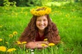 Summer portrait of a merry child with dandelions flowers.