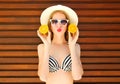 Summer portrait pretty young woman holds in hands oranges Royalty Free Stock Photo
