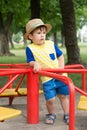 Summer portrait toddler boy in straw hat.