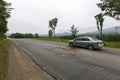 Summer, 2016 - Primorsky Krai, Russia - The car drives on a bad asphalt road. Killed Russian roads