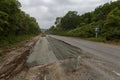 Summer, 2016 - Primorsky Krai, Russia - The car drives on a bad asphalt road. Killed Russian roads