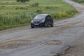 Summer, 2016 - Primorsky Krai, Russia - The car drives on a bad asphalt road. Killed Russian roads