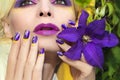 Summer purple yellow makeup and manicure .