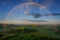 Summer rainbow over Czech Bohemian Highlands hills, Czech republic. Rainy sunset. Royalty Free Stock Photo