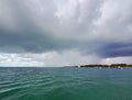 Summer rains over entrance to North Bimini channel, Bahamas. Royalty Free Stock Photo