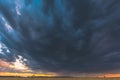 Summer Rainy Sunset Evening Above Wheat Field Landscape. Scenic Dramatic Sky With Rain Clouds. Agricultural And Weather Royalty Free Stock Photo