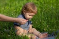 Summer ration, childcare. Good morning on the Farm. Mothers hand feeding baby with a spoon. Cute little baby is being Royalty Free Stock Photo