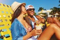 Summer is reason enough to smile. an affectionate young couple enjoying a few drinks poolside. Royalty Free Stock Photo