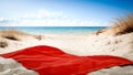 Summer red towel on the beach. Sand and sea background. Holidays time. Royalty Free Stock Photo