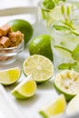 Summer refreshing cocktail caipirinha with lime and mint on white wooden vintage background. Royalty Free Stock Photo