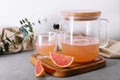 Summer refreshing grapefruit drink, jug and glass