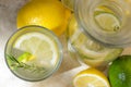 Summer refreshing lemonade drink with ingredients on light table, top view Royalty Free Stock Photo