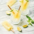 Summer refreshing lemonade popsicles with lime and mint Royalty Free Stock Photo