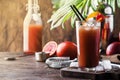 Summer refreshing low alcohol cocktail with vodka, orange juice, bloody orange and ice. Hot day at the beach bar. Selective focus Royalty Free Stock Photo