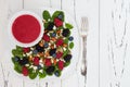 Summer refreshing spinach mixed berry salad with pumpkin and sunflower seeds, almonds, feta cheese and red raspberry vinaigrette Royalty Free Stock Photo