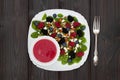 Summer refreshing spinach mixed berry salad with pumpkin and sunflower seeds, almonds, feta cheese and red raspberry vinaigrette Royalty Free Stock Photo