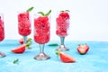 Summer refreshing strawberry sorbet, slush granita drink in serving glasses