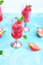 Summer refreshing strawberry sorbet, slush granita drink in serving glasses