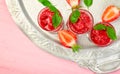 Summer refreshing strawberry sorbet, slush granita drink in serving glasses on silver tray