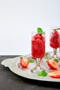 Summer refreshing strawberry sorbet, slush granita drink in serving glasses