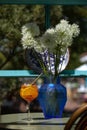 Summer refreshment aperitif cocktail in wine glass with ice rocks, bamboo straw and sliced oranges in tropical summer garden Royalty Free Stock Photo