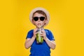 Summer refreshment. Cold beverage. Little boy with plastic cup of fresh lemonade Royalty Free Stock Photo