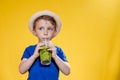 Summer refreshment. Cold beverage. Little boy with plastic cup of fresh lemonade Royalty Free Stock Photo