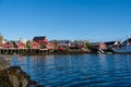 Summer in Reine, Lofoten Islands, Norway. Popular tourist destination. Old fishermans village with wooden red cottages