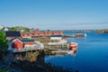 Summer in Reine, Lofoten Islands, Norway. Popular tourist destination. Old fishermans village with wooden red cottages