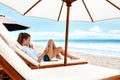 Summer Relaxation. Woman Reading, Relaxing On Beach. Summertime