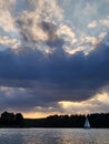 summer relaxing dusk lake landscape with a sailboat Royalty Free Stock Photo