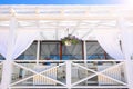 Summer restaurant under a canopy. Dining table for a romantic lunch on the beach against the sky. Rest and quiet life on the beach