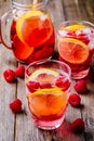 Sparkling Lemon Raspberry Lemonade Sangria in glass on wooden background Royalty Free Stock Photo