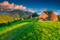 Summer rural landscape with hay bales, Brasov region, Transylvania, Romania Royalty Free Stock Photo