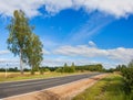 Summer rural landscape panorama with road,forest,field and blue Royalty Free Stock Photo