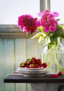 Summer rustic still life with strawberry and peony bouquet Royalty Free Stock Photo