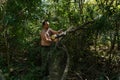 Summer's Grind: Young Lumberjack Tackling Fallen Timber