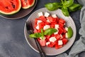 Summer salad of watermelon, feta cheese and green basil, healthy food, horizontal orientation, top view