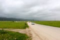 Lush green landscape, trees and foggy mountains in Ayn Khor tourist resort, Salalah, Oman