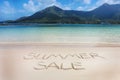 The Summer sale word written on the beach sand. Royalty Free Stock Photo