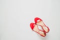 Red sandals on white background top view, flat lay, fashion, minimalism concept. Top view Royalty Free Stock Photo
